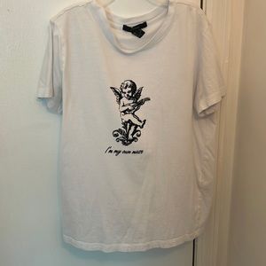 A white, I’m my own muse shirt. It’s from Forever 21.